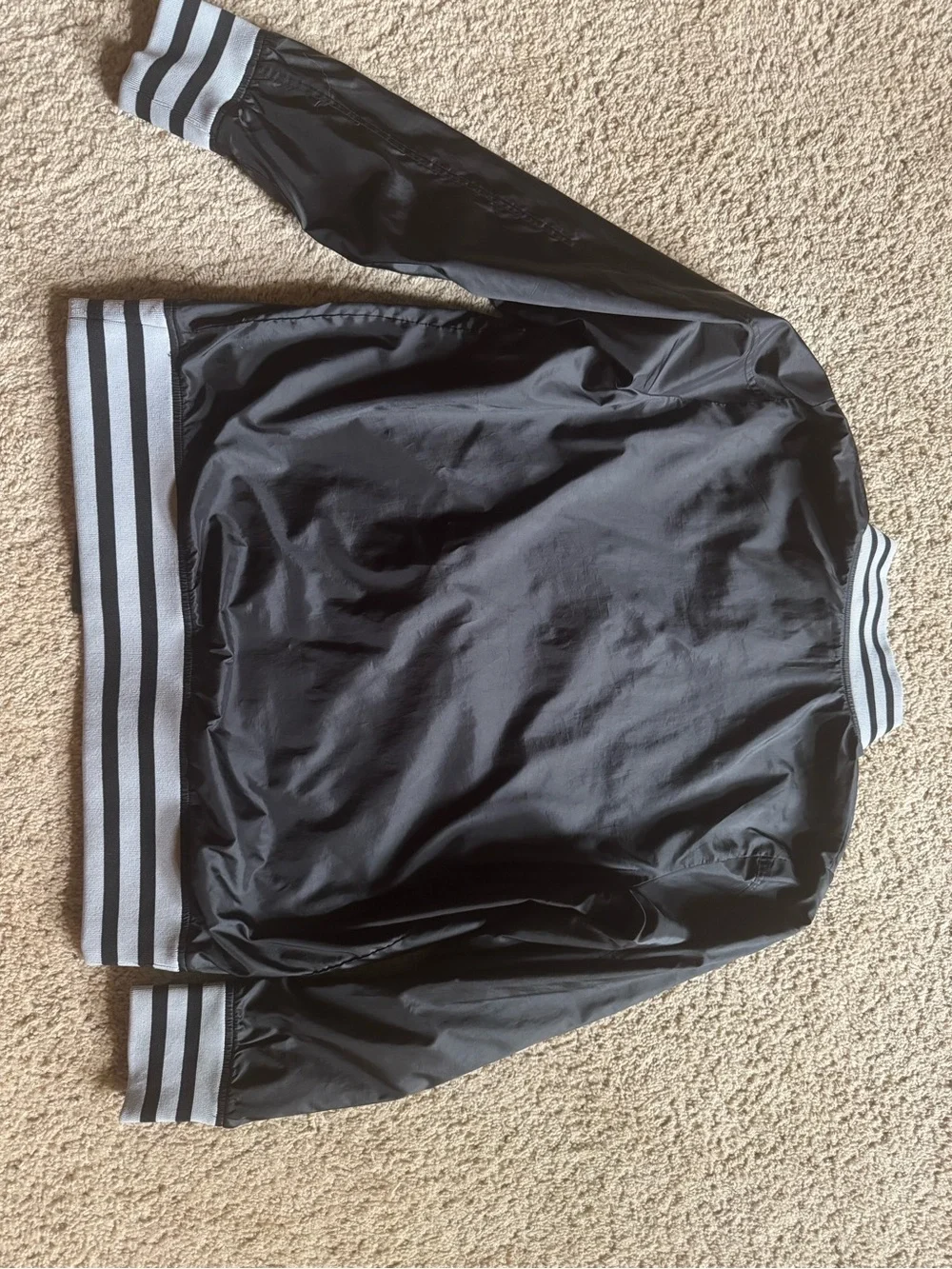 The North Face Black Bomber Jacket with Gray/Black Striped Trim